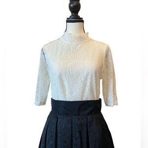 Women’s white lace top short sleeves. Mock turtleneck. Lining. Size medium.